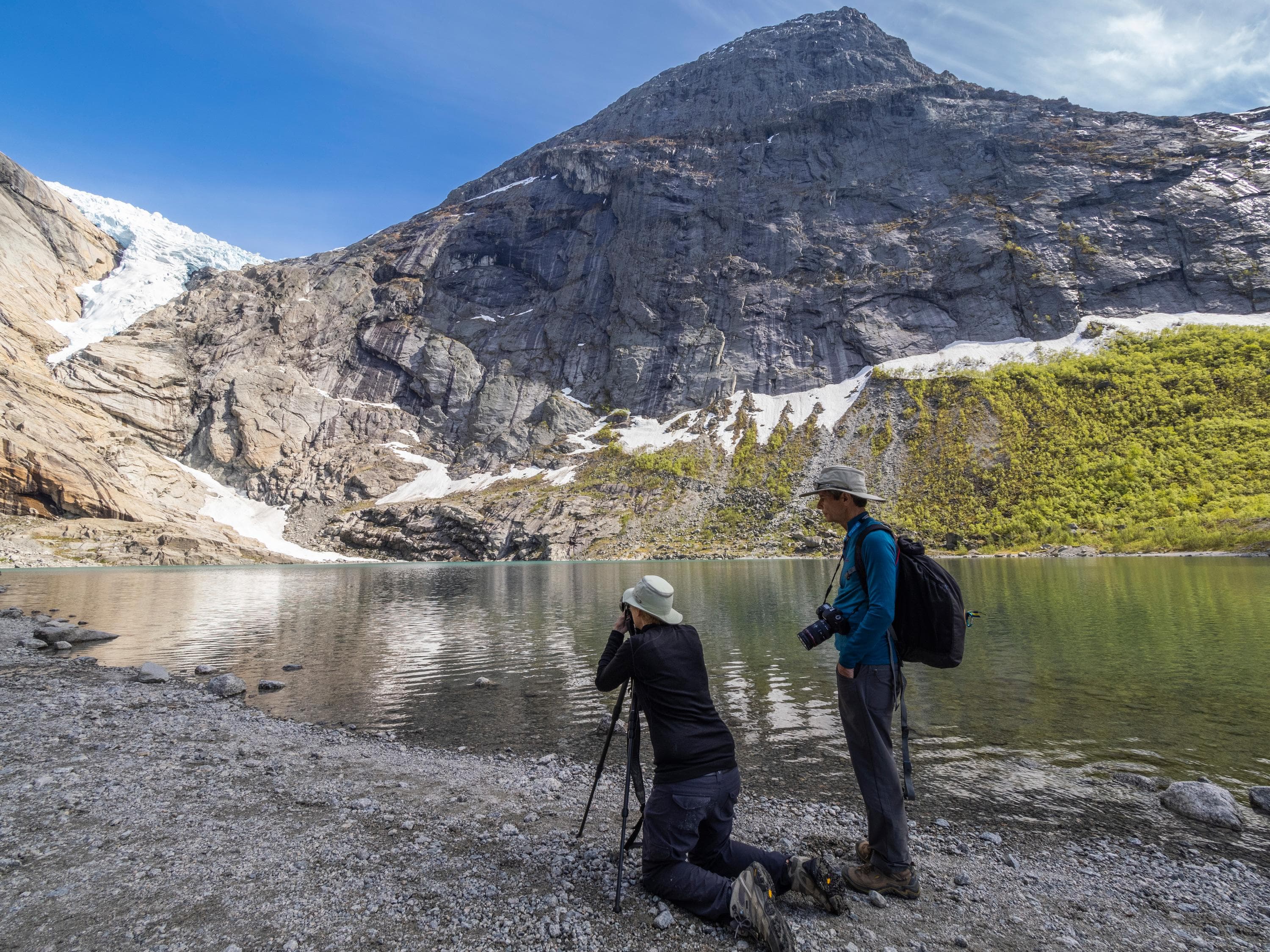 Lindblad Expeditions guests at the ake in front of the Briksdal glacier, one of the best known arms of the Jostedalsbreen glacier, Norway..