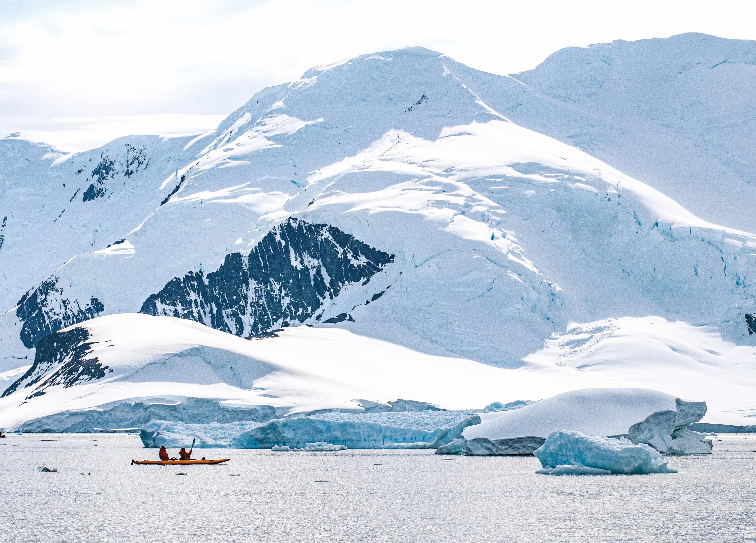 Guests exploring by kayak in Antarctica.