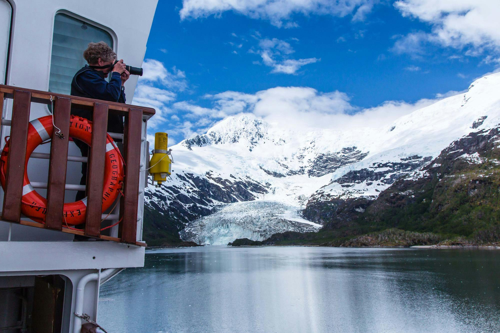 A guest photographing in the Strait of Magellan, Patagonia, Chile.