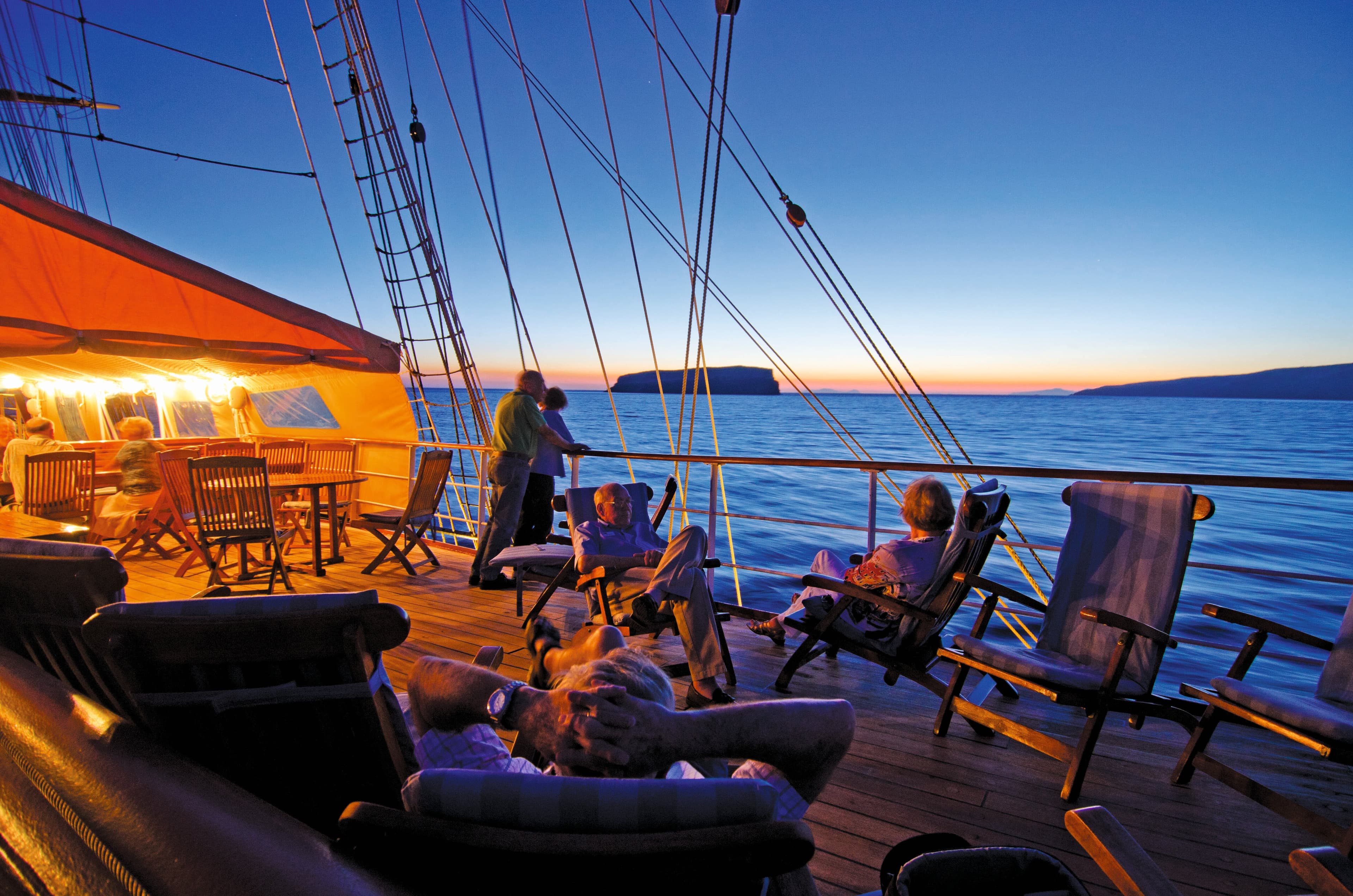 Guests enjoy the Lido deck lounge on the ship Sea Cloud.