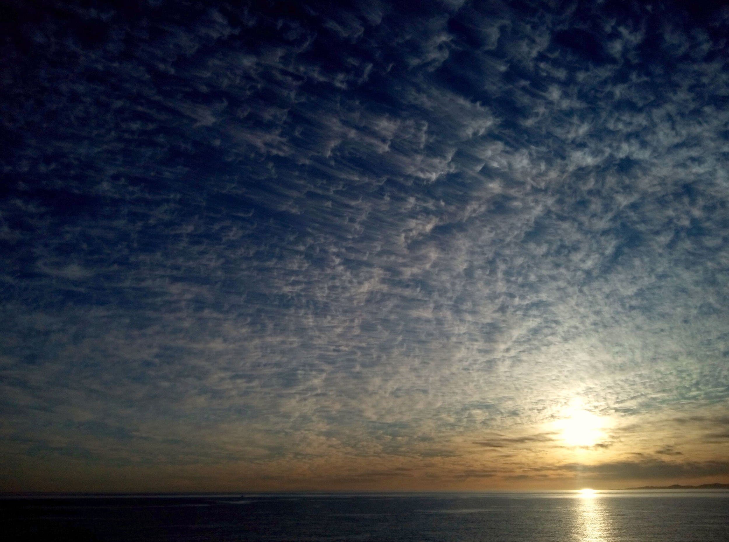 a sunrise over water in Baja California