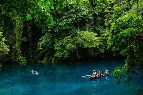 Paddling the crystal clear Riri Blue Hole grotto in Vanuatu