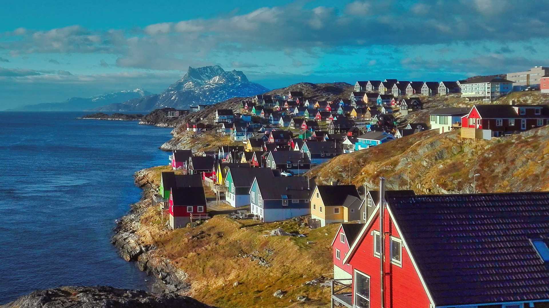 Small multi-colored houses on the coast of Nuuk.