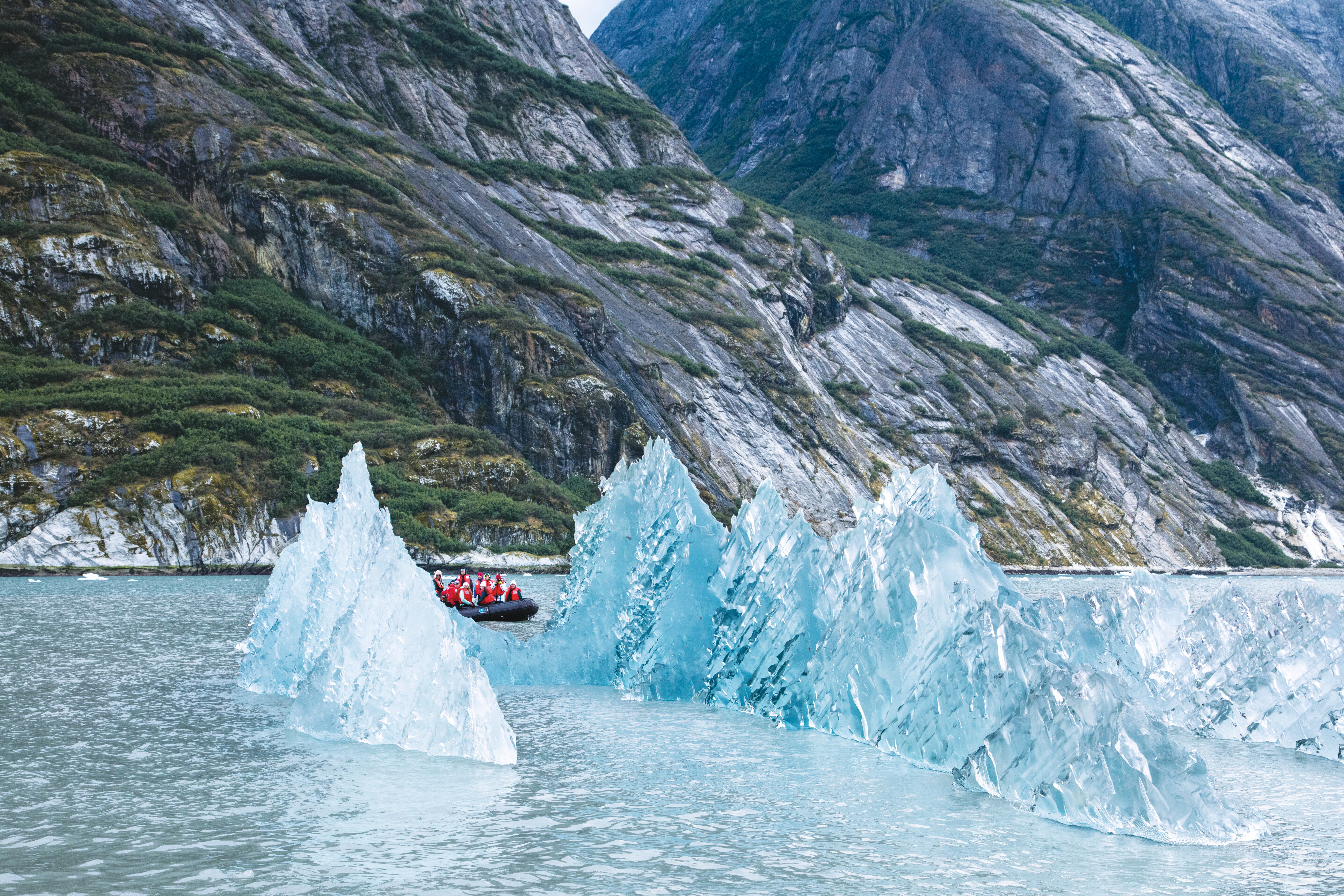 Guests explore the LeConte Glacier by zodiac in Southeast Alaska, USA