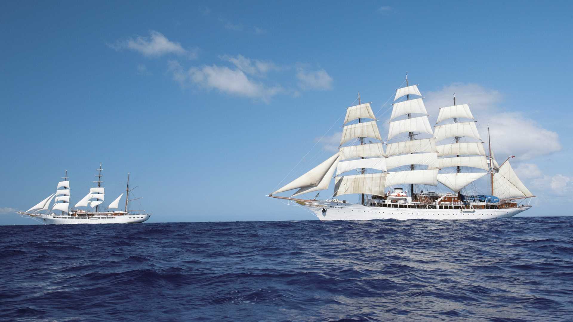 The ships Sea Cloud & Sea Cloud II sailing together at full sail.