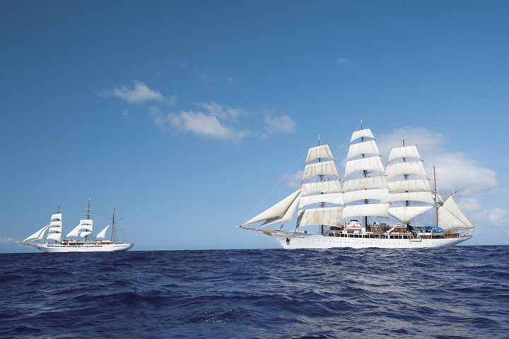 The ships Sea Cloud & Sea Cloud II sailing together at full sail.
