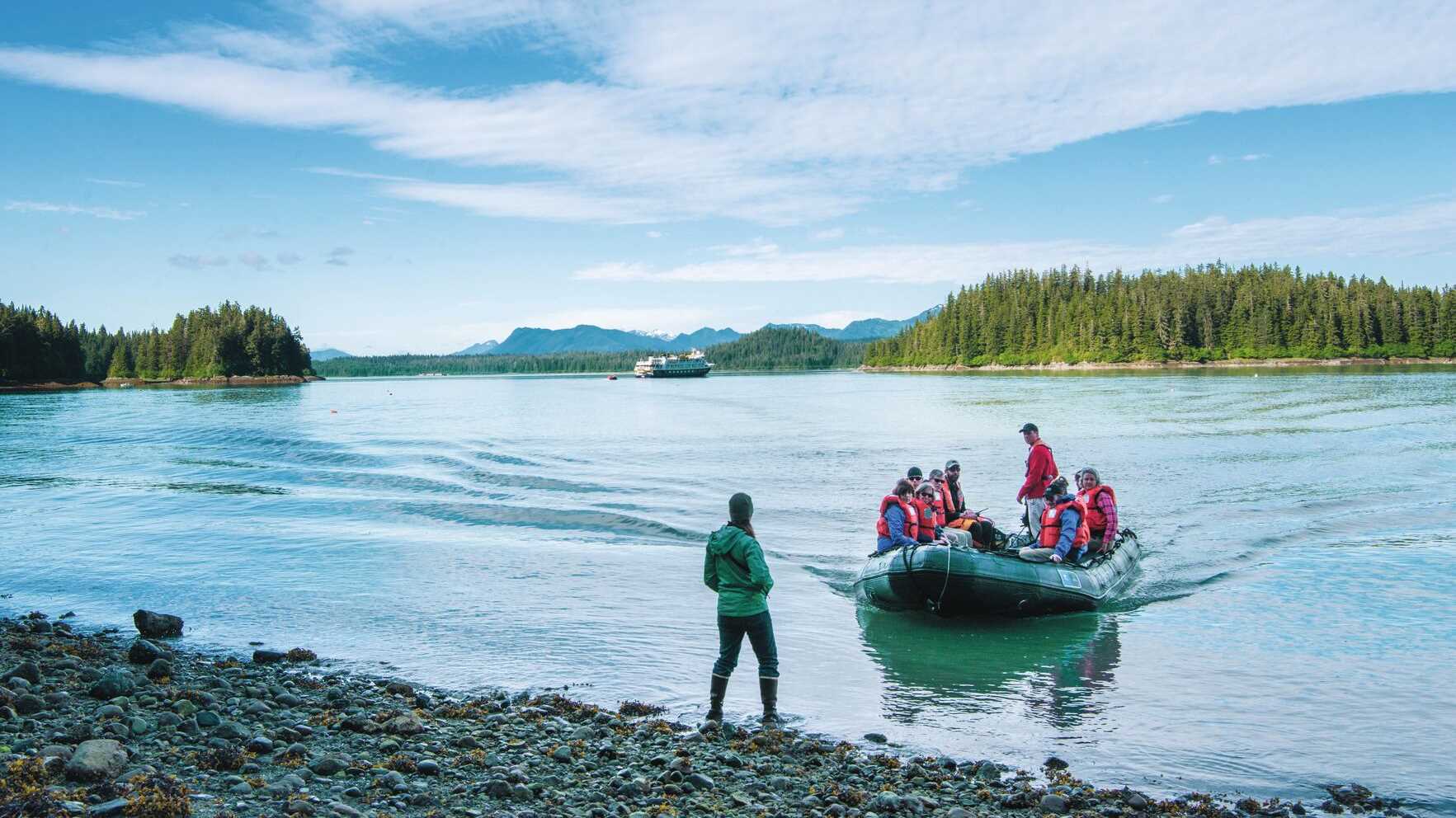 Explorers in a Zodiac come ashore in Alaska