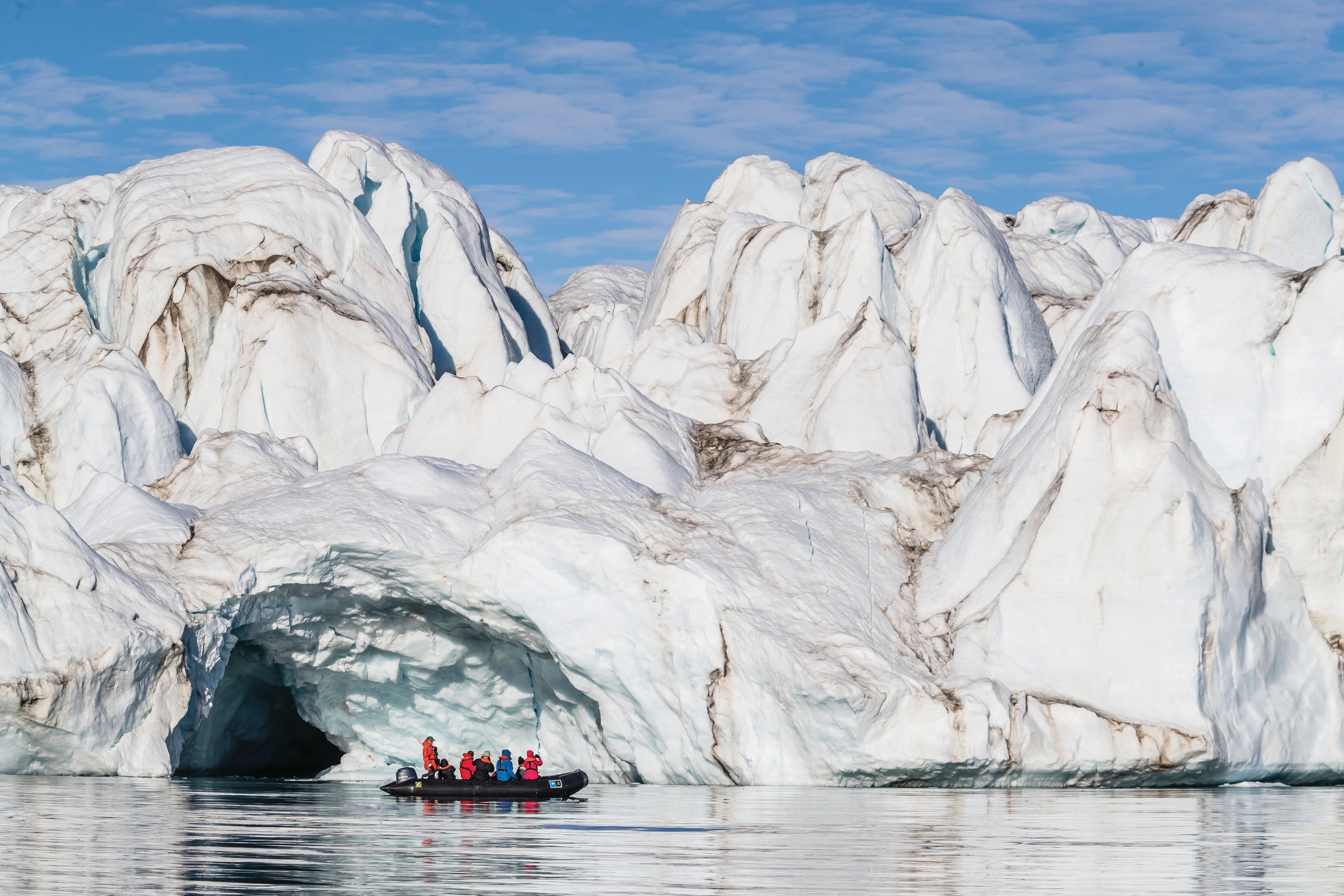 Guests explore by Zodiac in the calm waters of Makinson Inlet, Ellesmere Island, Nunavut, Canada.