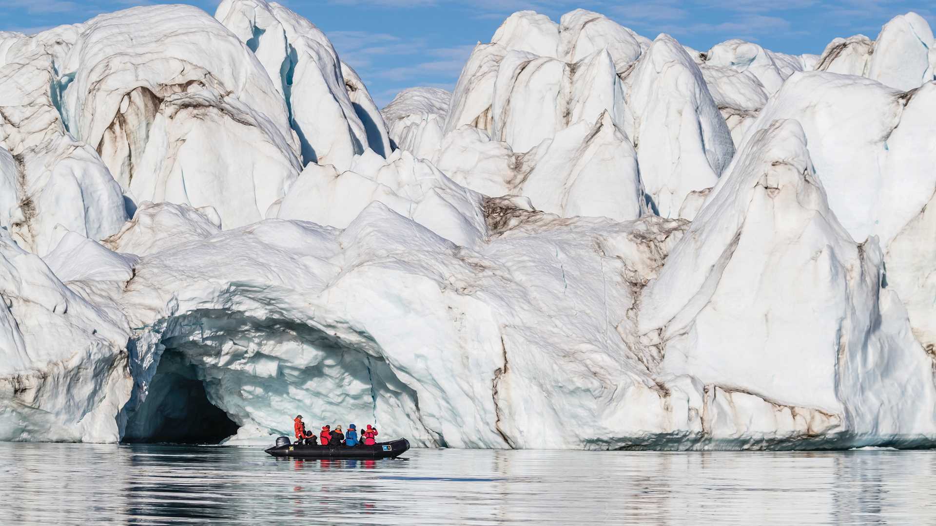 Guests explore by Zodiac in the calm waters of Makinson Inlet, Ellesmere Island, Nunavut, Canada.
