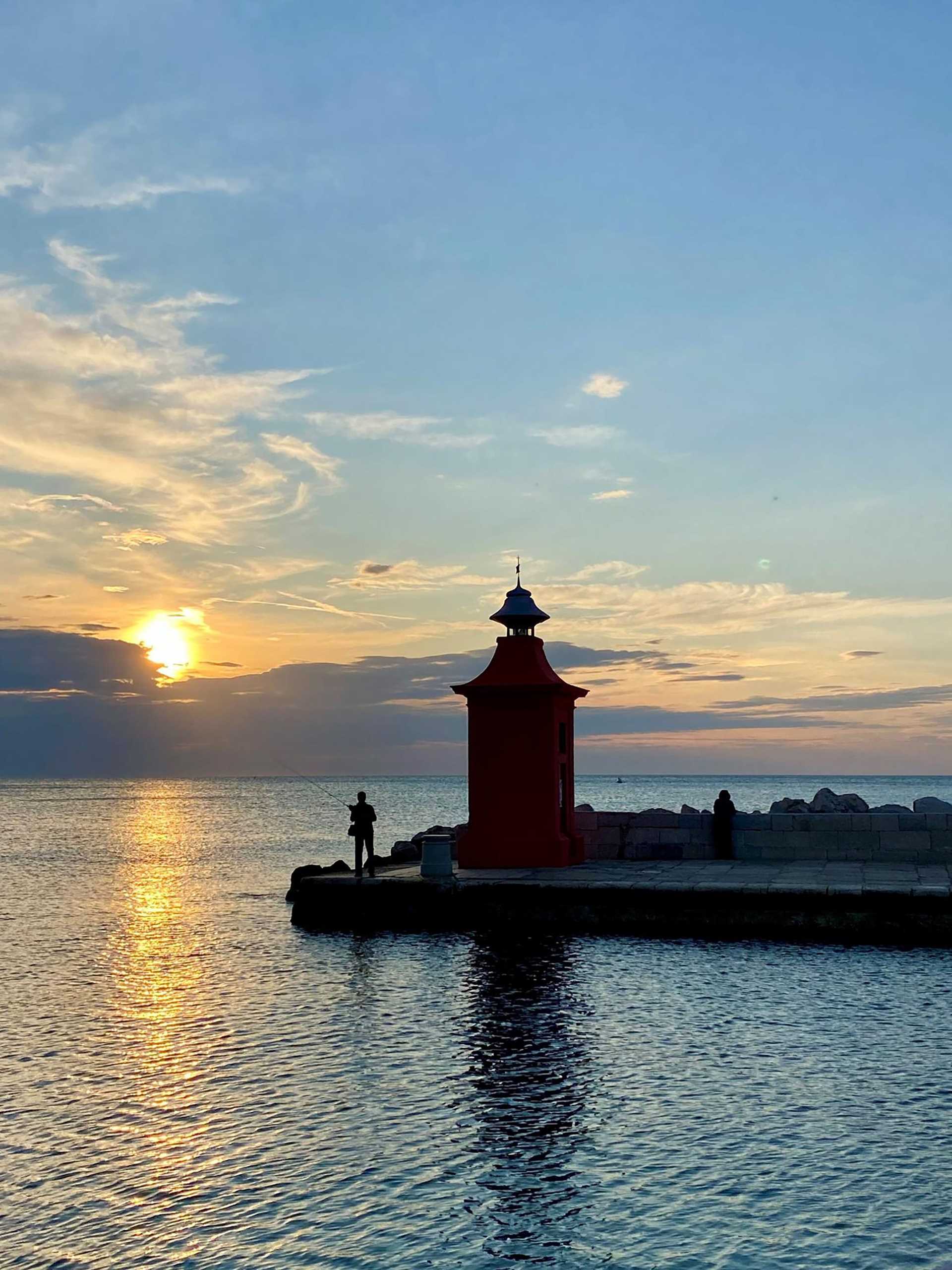 sunset over a lighthouse