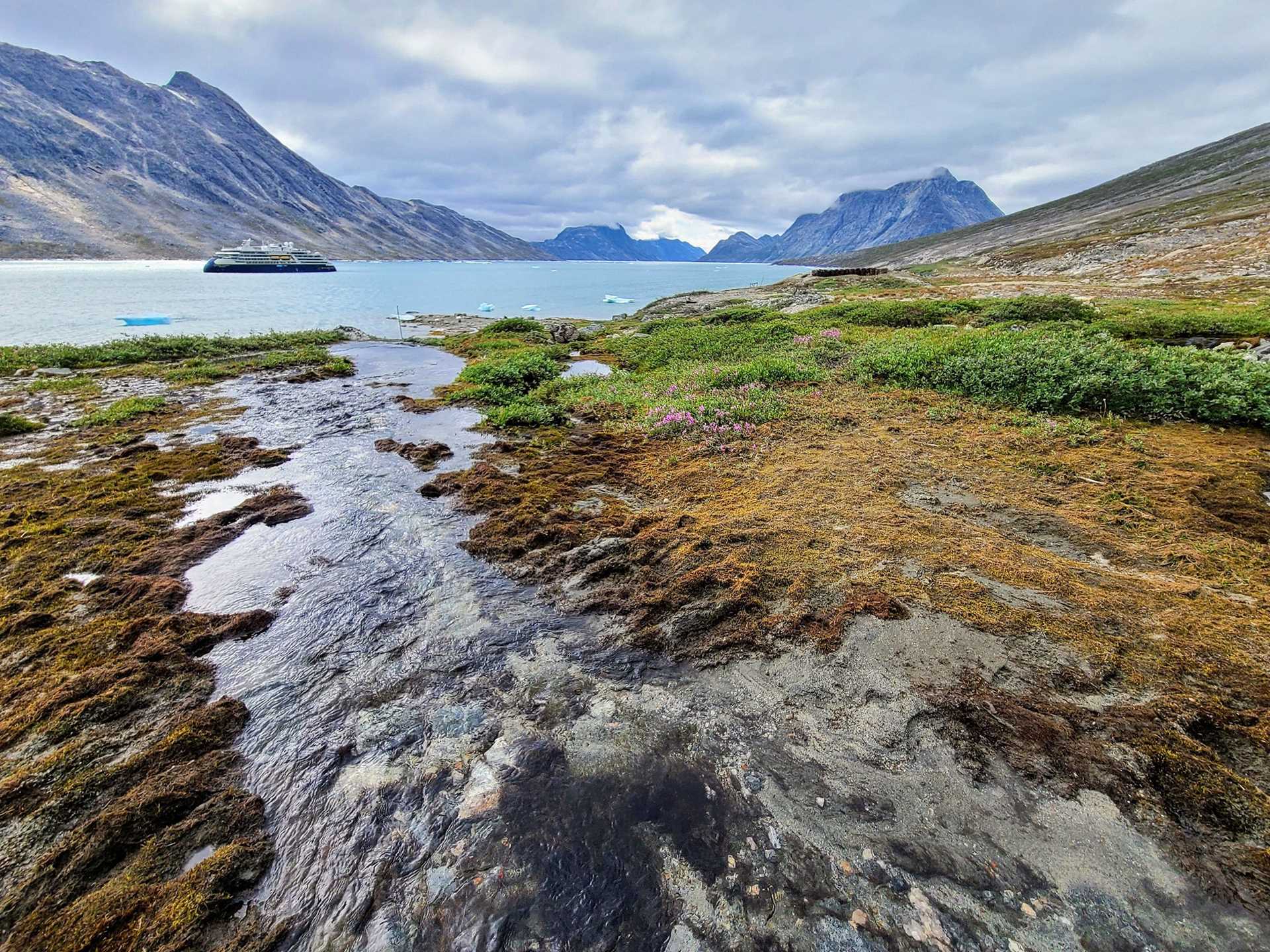 Greenlandic landscape with ship in background