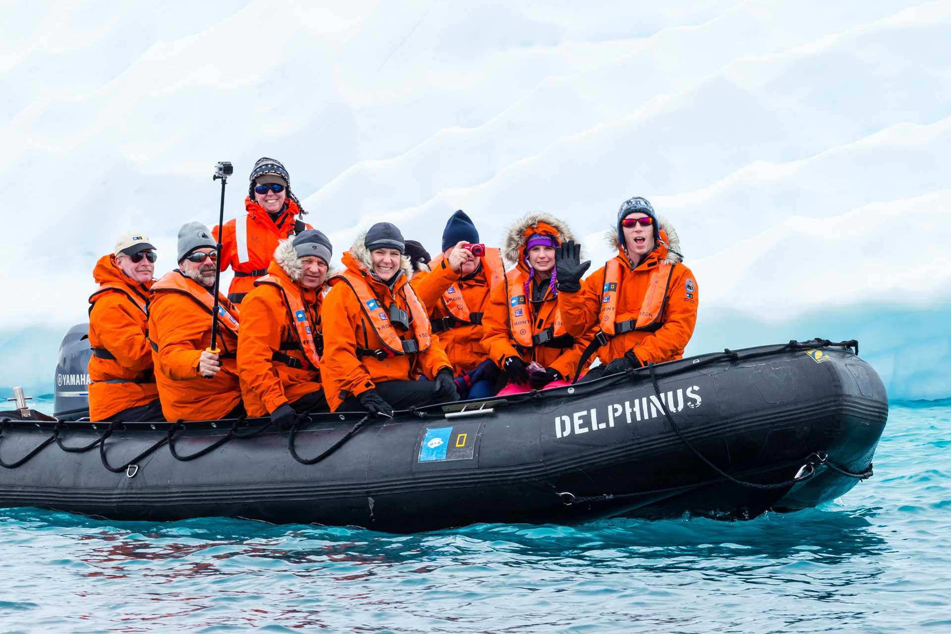 Seven guests, two female and five male, and a female naturalists on a Zodiac off Culverville Island.