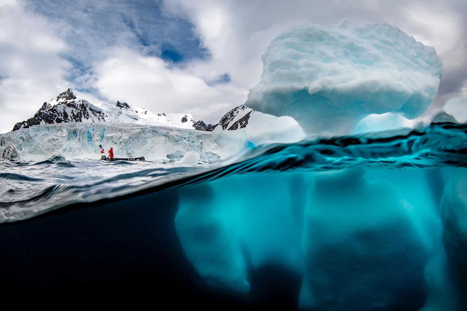 iceberg as seen from above and below the water