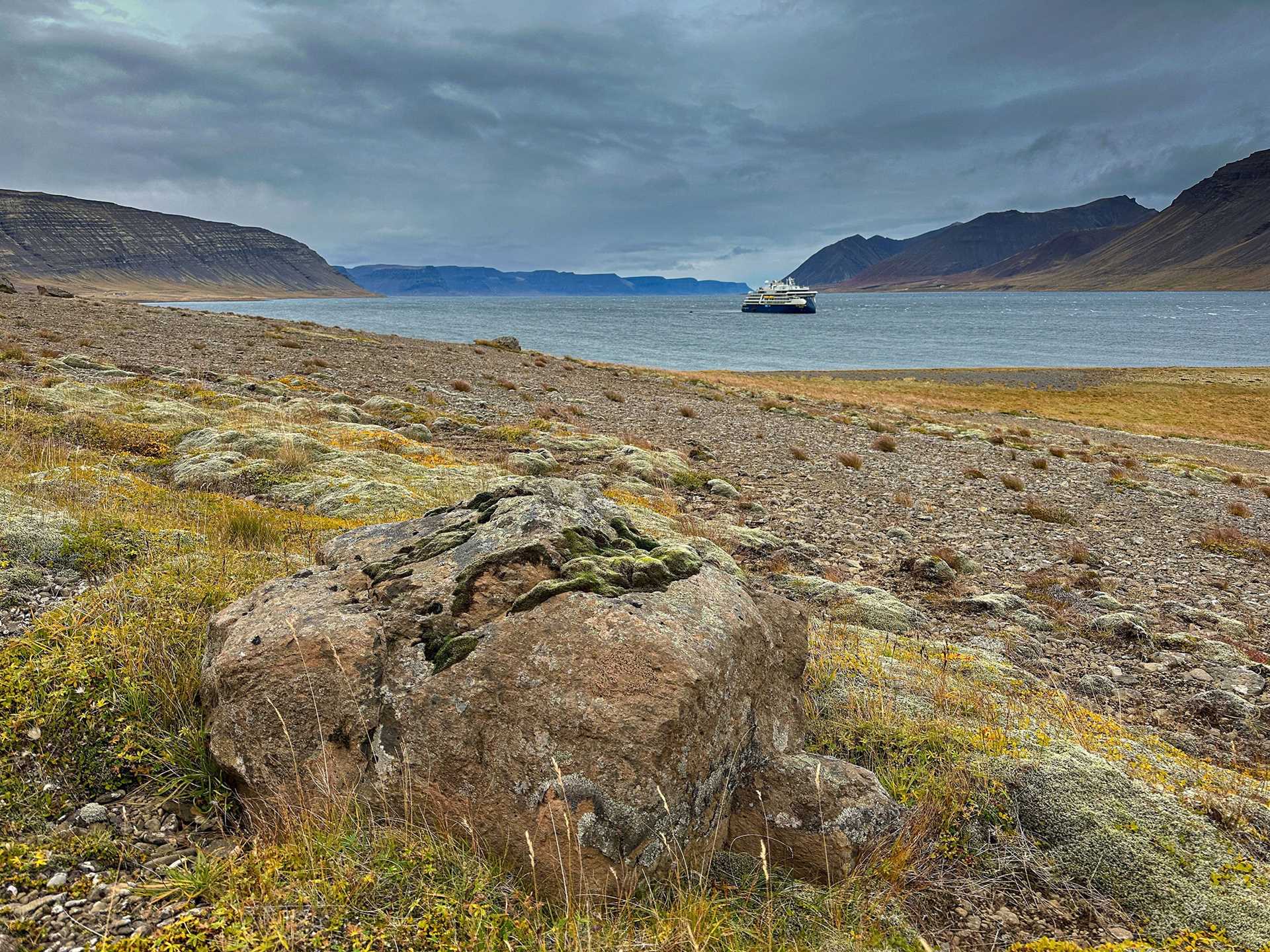 national geographic endurance ship behind icelandic landscape